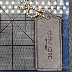 Coach Silver Leather Tag